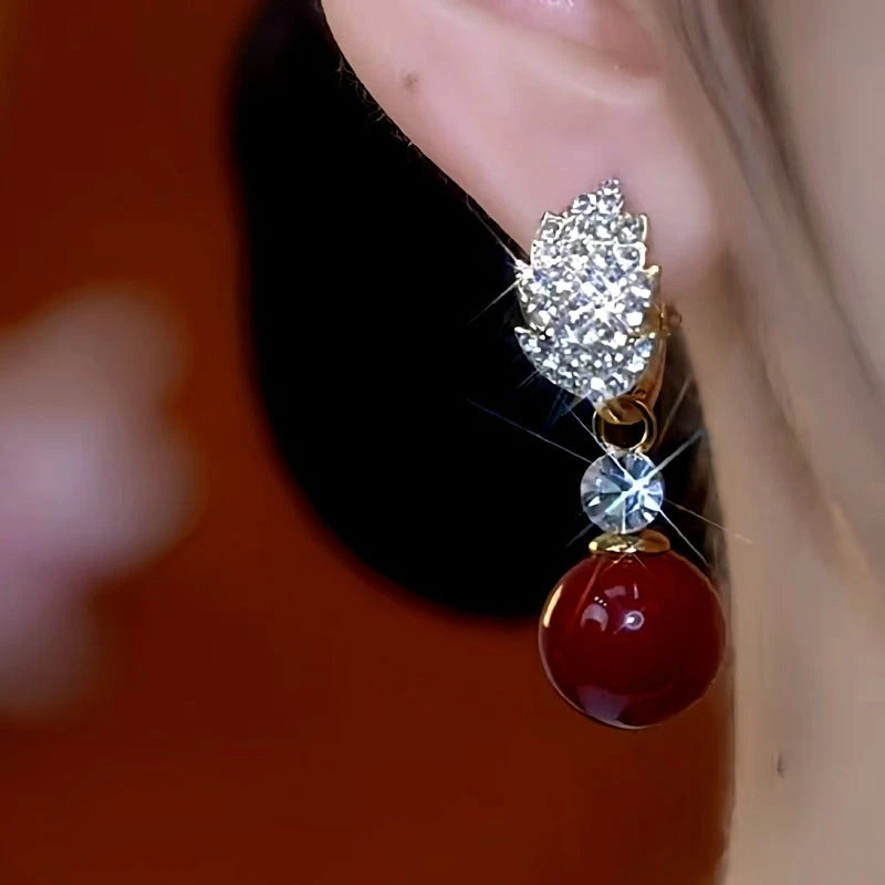 Close-up detail of the sparkling zircons and plating on the Jade Leaf Earrings