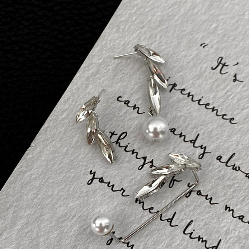 Close-up detail of the sparkling zircons and plating on the Leaf Ear Cuff