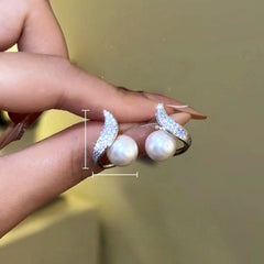 Model showcasing the dangle and style of the 14K Gold-Plated Zircon Diamond Leaf Bead Earrings