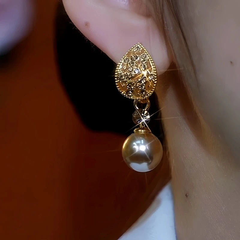 Close-up detail of the sparkling zircons and plating on the Leaf Pearl Earrings