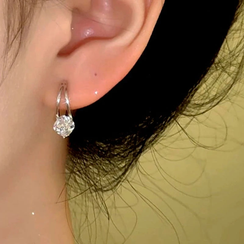 Angled view of the 14K Gold-Plated Zircon Diamond Little Hoop Earrings