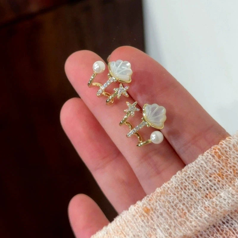 Close-up detail of the sparkling zircons and plating on the Star Stud Earrings