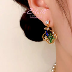 Close-up detail of the sparkling zircons and plating on the Peacock Earrings