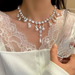 Close-up of the pendant and clasp on the Pearl Drop Necklace