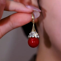 Close-up detail of the sparkling zircons and plating on the Pearl Ear Hooks