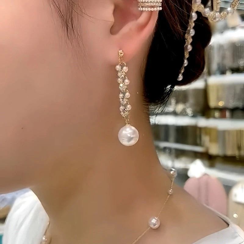 Close-up detail of the sparkling zircons and plating on the Gold Pearl Earrings