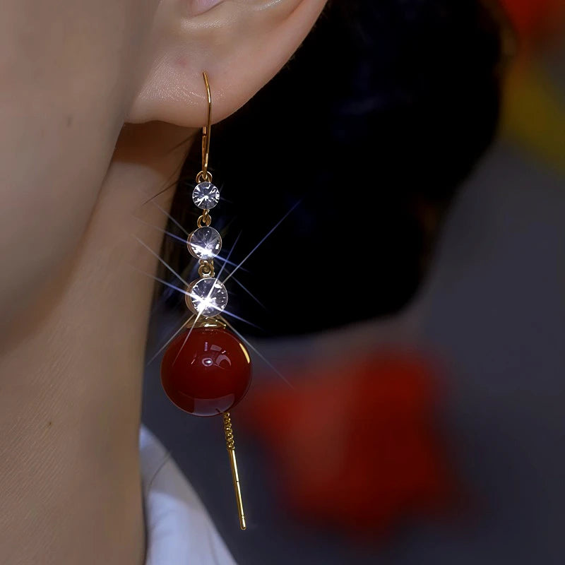 Close-up detail of the sparkling zircons and plating on the Pearl Threader Earrings