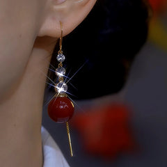 Close-up detail of the sparkling zircons and plating on the Pearl Threader Earrings