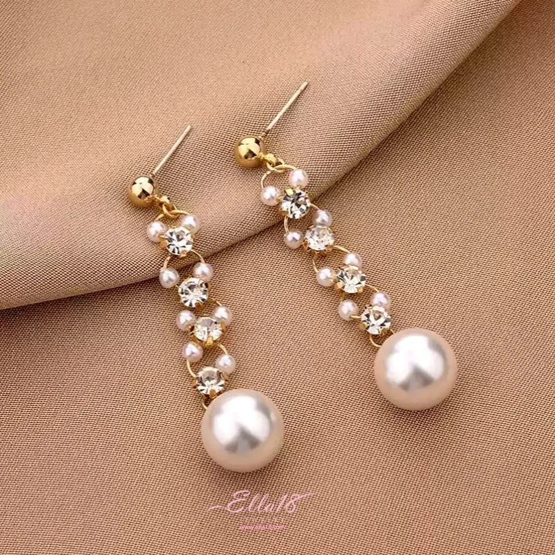 Angled view of the 14K Gold-Plated Zircon Diamond Pearl Earrings