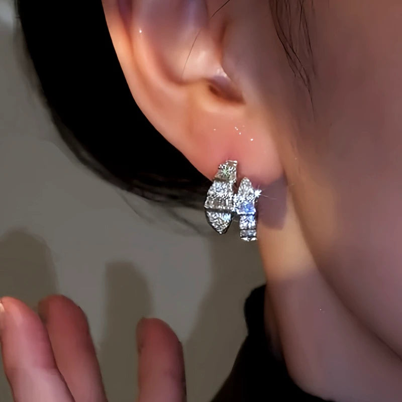 Model showcasing the dangle and style of the 14K Gold-Plated Zircon Diamond Snake-Shaped Earrings