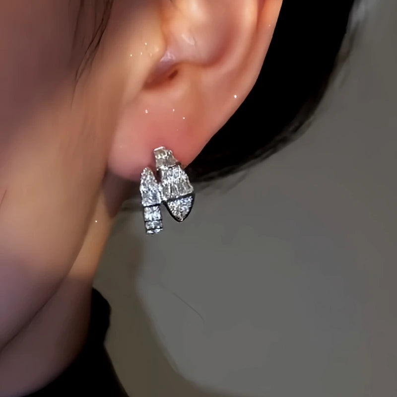 Close-up detail of the sparkling zircons and plating on the Snake Shaped Earrings