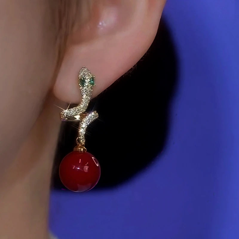 Close-up detail of the sparkling zircons and plating on the Snake Pearl Earrings