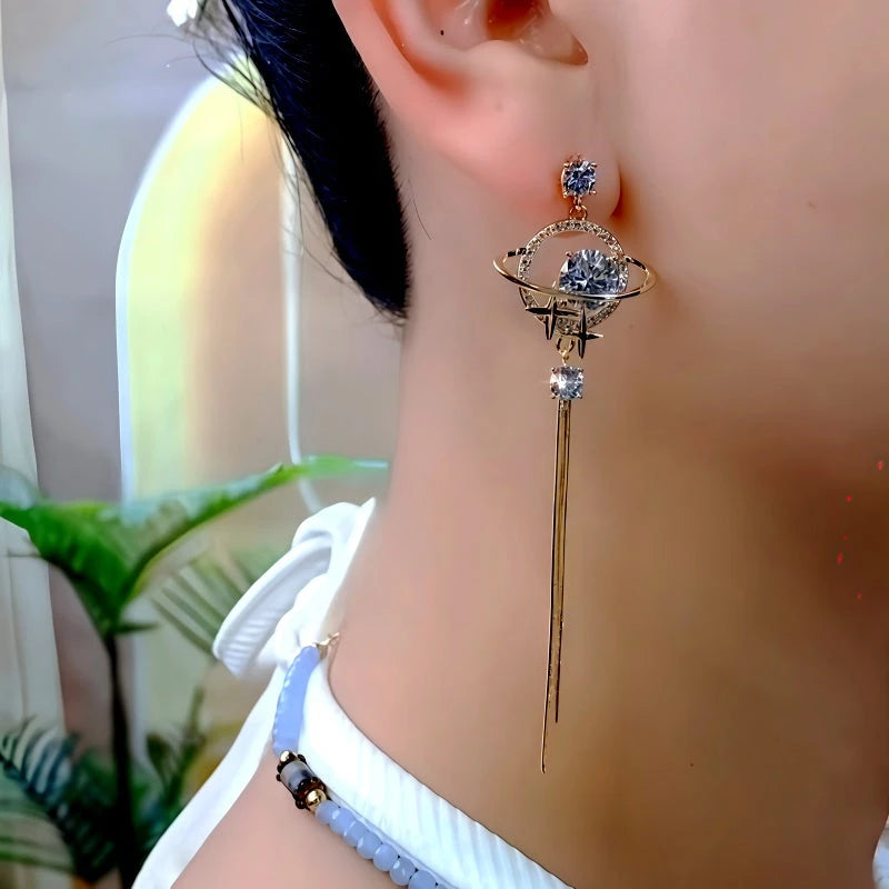 Model showcasing the dangle and style of the 14K Gold-Plated Zircon Diamond Sun Moon Star Tassel Earrrings