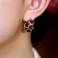 Close-up detail of the sparkling zircons and plating on the Sunflower Hoop Earrings