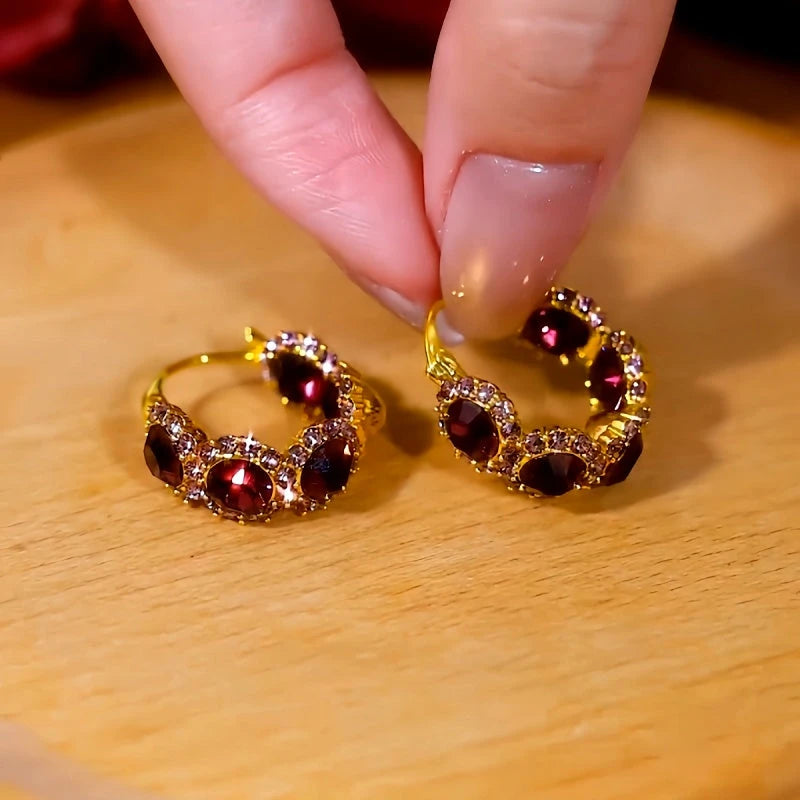Model showcasing the dangle and style of the 14K Gold-Plated Zircon Diamond Sunflower Hoop Earrings
