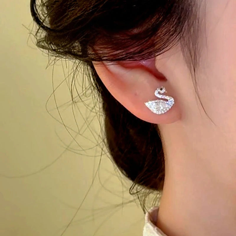 Close-up detail of the sparkling zircons and plating on the Swan Stud Earrings