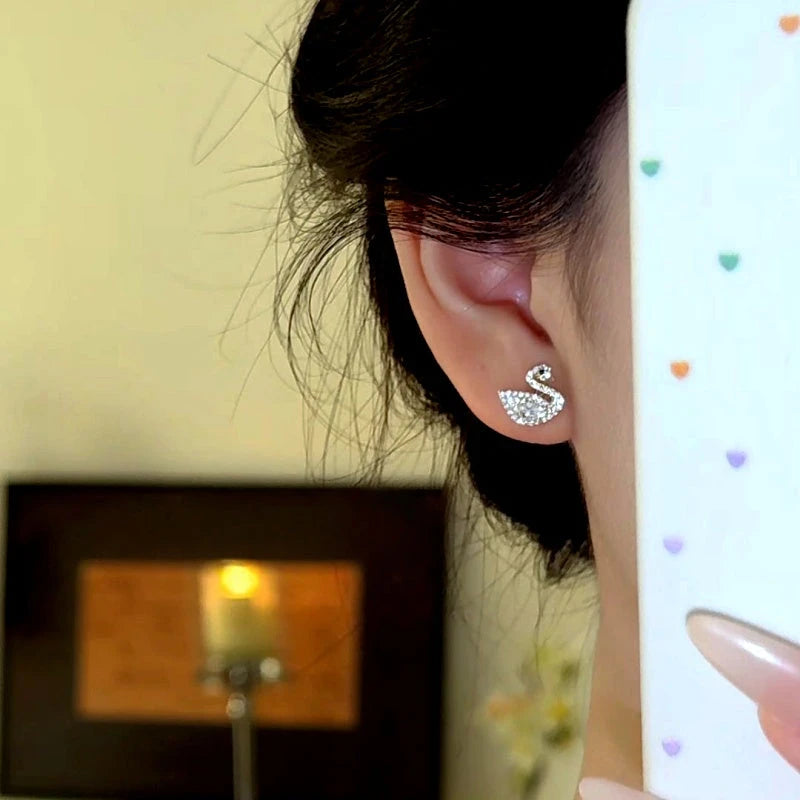 Angled view of the 14K Gold-Plated Zircon Diamond Swan Stud Earrings