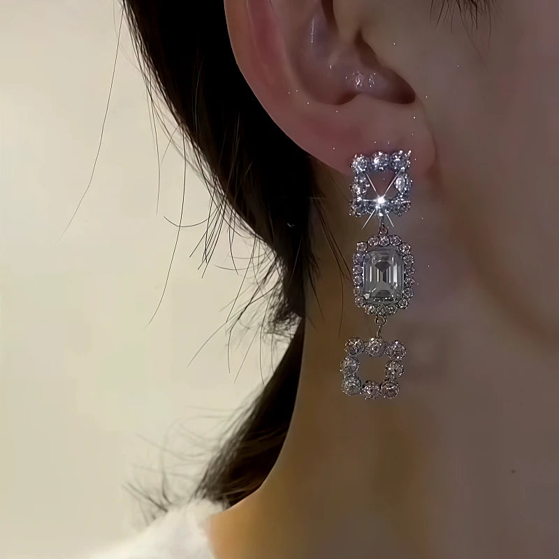 Model showcasing the dangle and style of the 14K Gold-Plated Zircon Diamond Tassel Earrings