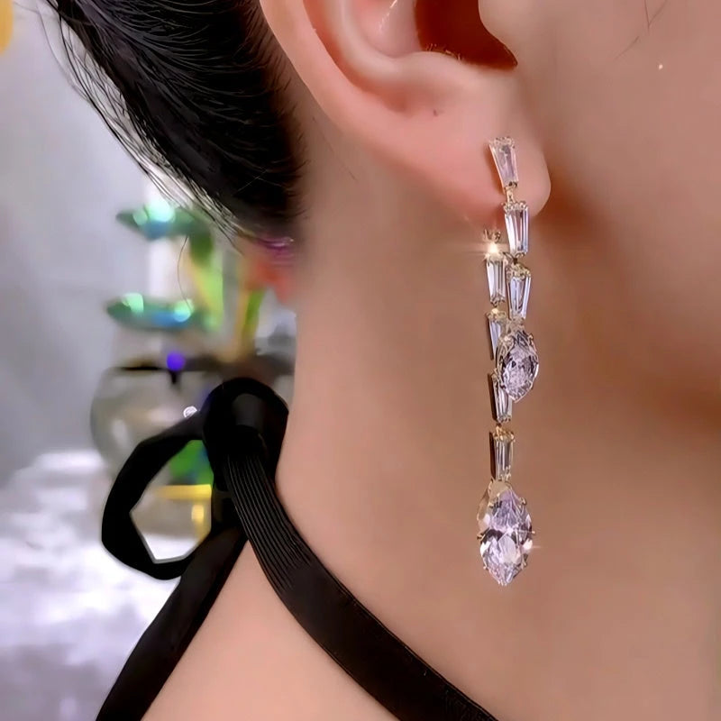 Close-up detail of the sparkling zircons and plating on the Gold Tassel Earrings