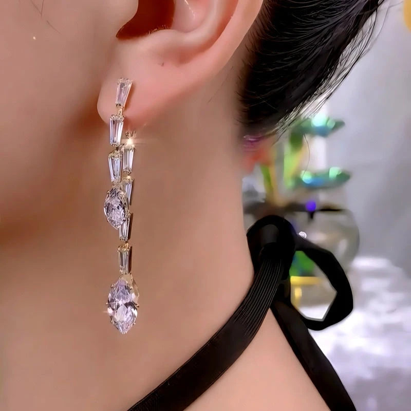 Model showcasing the dangle and style of the 14K Gold-Plated Zircon Diamond Tassel Earrings