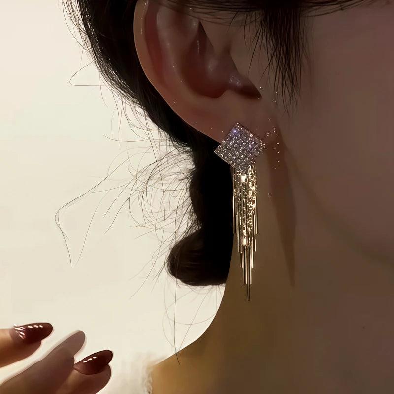 Angled view of the 14K Gold-Plated Zircon Diamond Tassel Earrings