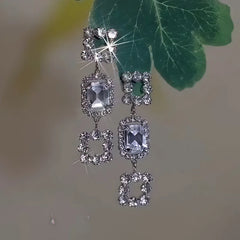 Angled view of the 14K Gold-Plated Zircon Diamond Tassel Earrings