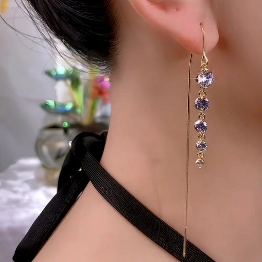Model showcasing the dangle and style of the 14K Gold-Plated Zircon Diamond Tassel Threader Earrings
