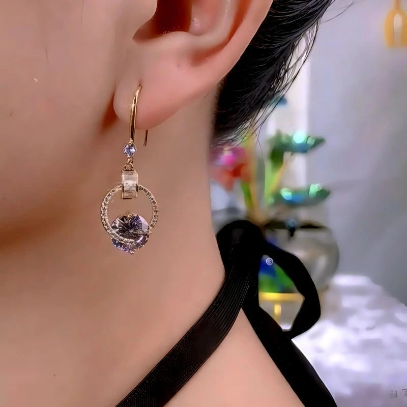 Close-up detail of the sparkling zircons and plating on the Water Drop Threader Earrings