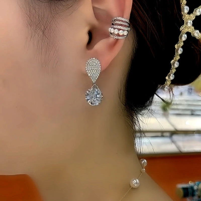 Model showcasing the dangle and style of the 14K Gold-Plated Zircon Diamond Water Drop Earrings