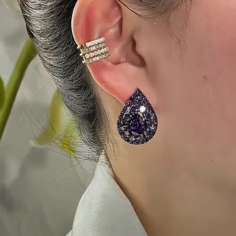 Close-up detail of the sparkling zircons and plating on the Purple Water Drop Studs