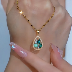 Close-up of the pendant and clasp on the Green Water Drop Necklace