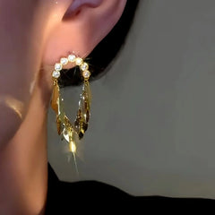 Model showcasing the dangle and style of the 14K Gold-Plated Zircon Diamond Wheat Tassel Earrings
