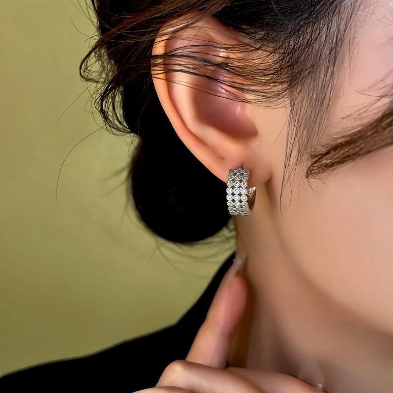 Model showcasing the dangle and style of the 14K Gold-Plated Zircon Diamond Wide Hoop Earrings