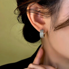 Model showcasing the dangle and style of the 14K Gold-Plated Zircon Diamond Wide Hoop Earrings