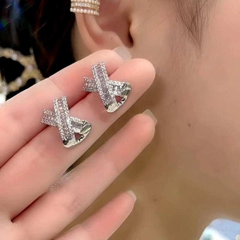 Close-up detail of the sparkling zircons and plating on the X-Shaped Studs
