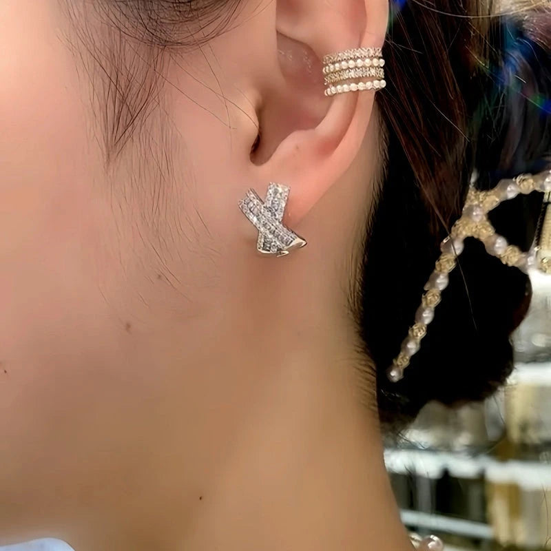 Angled view of the 14K Gold-Plated Zircon Diamond X-Shaped Elegant Studs