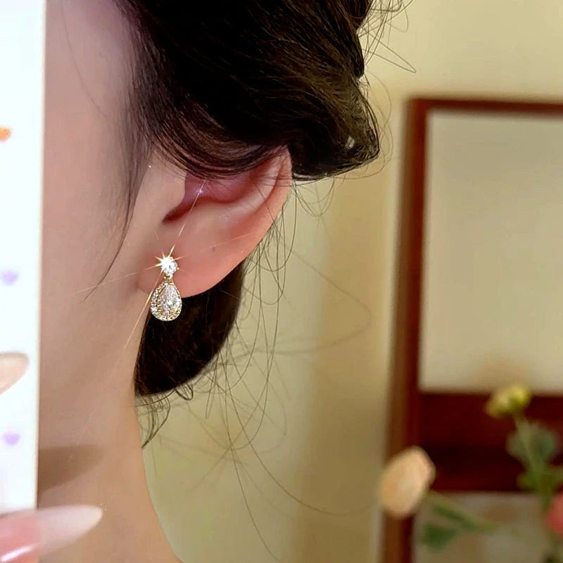 Close-up detail of the sparkling zircons and plating on the Water Drop Earrings