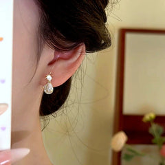 Close-up detail of the sparkling zircons and plating on the Water Drop Earrings