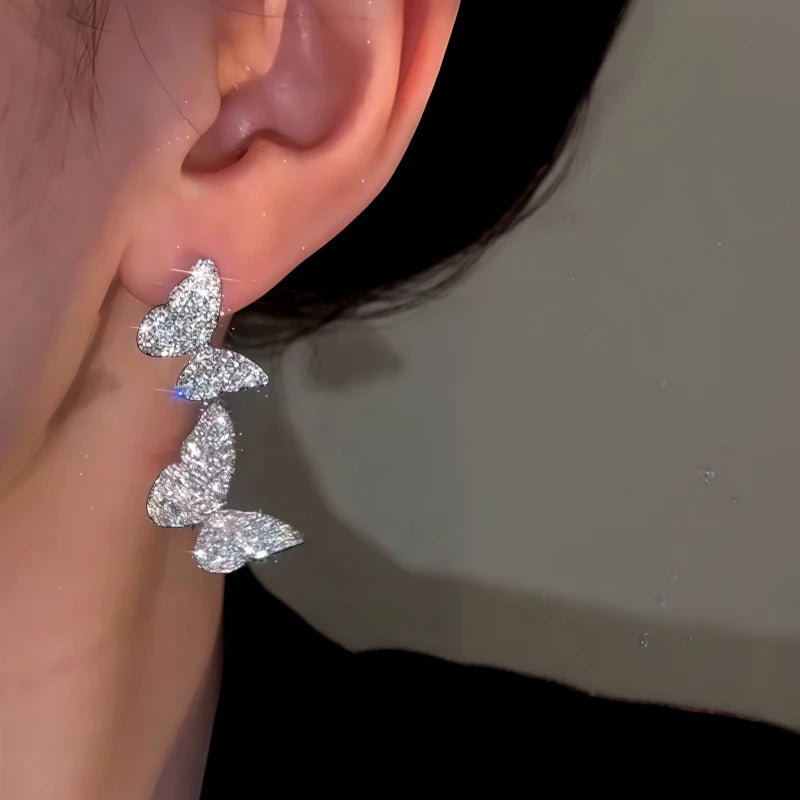 Close-up detail of the sparkling zircons and plating on the Double Butterfly Earrings