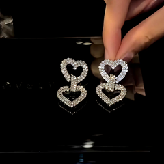 Angled view of the 14K Gold-Plated Zircon Double-Heart Earrings