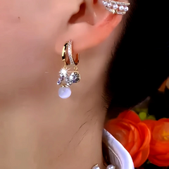 Close-up detail of the sparkling zircons and plating on the Cat's Eye Bead Earrings
