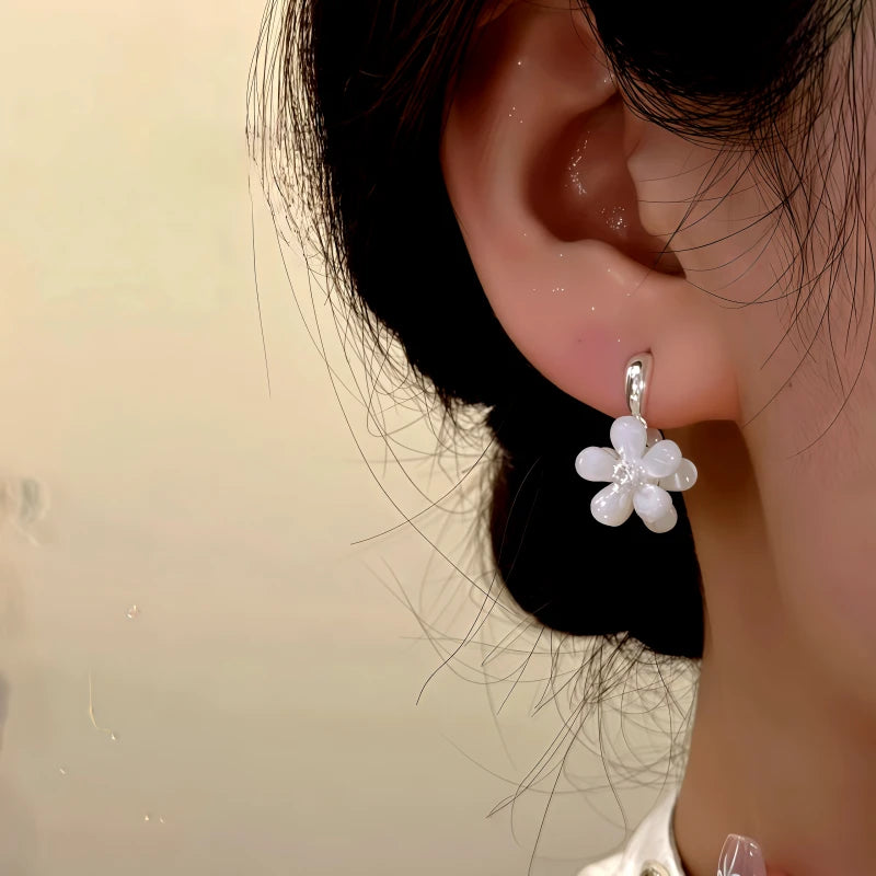 Close-up detail of the sparkling zircons and plating on the Double-Sided Flower Earrings