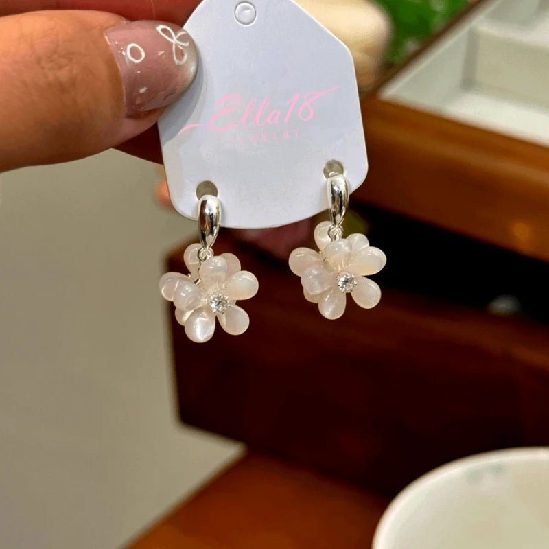 Angled view of the 14K Gold-Plated Zircon Double-Sided Flower Earrings