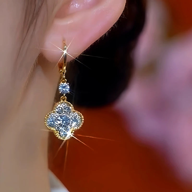 Close-up detail of the sparkling zircons and plating on the Reversible Clover Earrings