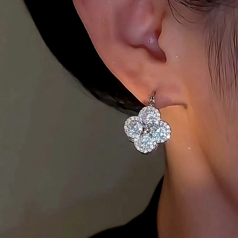 Close-up detail of the sparkling zircons and plating on the Reversible Flower Earrings