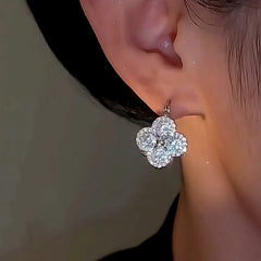 Close-up detail of the sparkling zircons and plating on the Reversible Flower Earrings