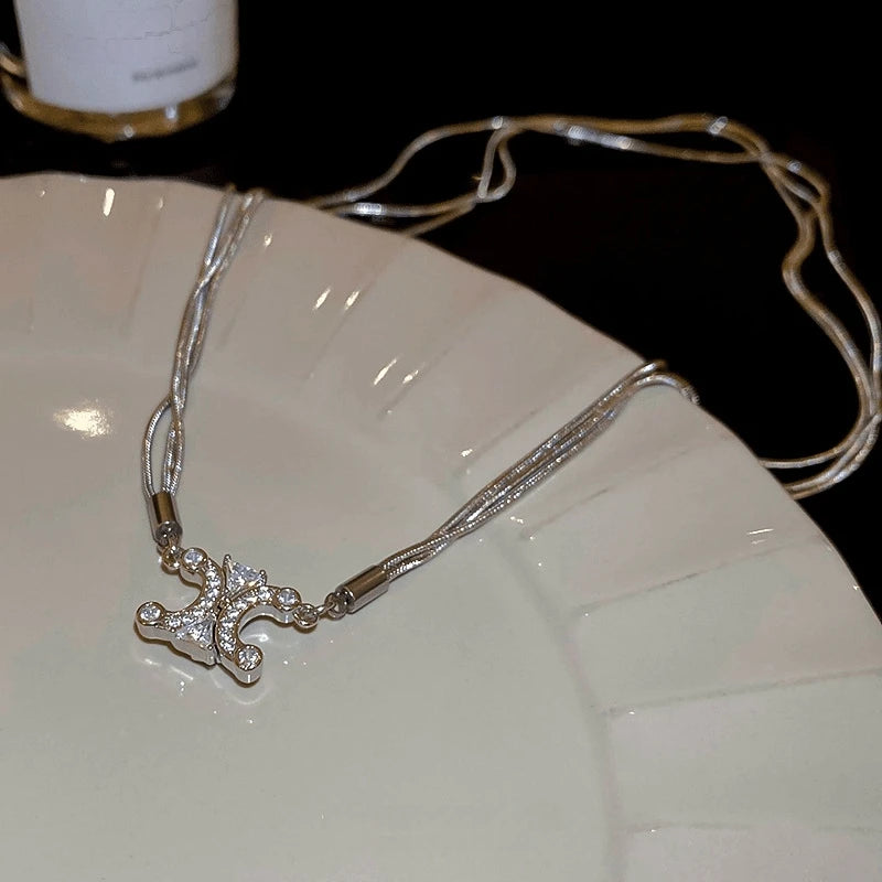 Close-up of the pendant and clasp on the Convertible Clover Necklace