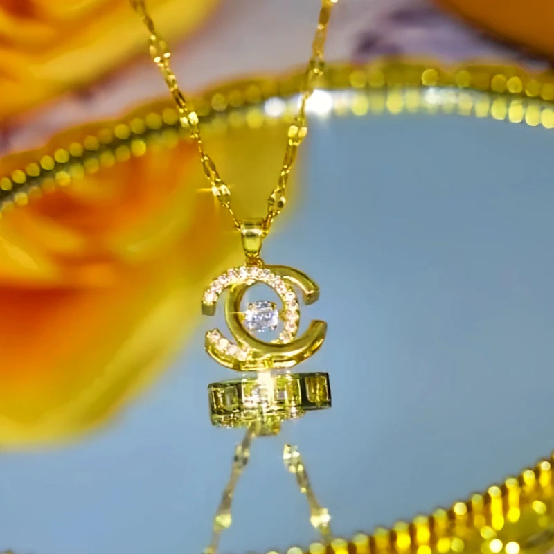 Close-up of the pendant and clasp on the Double C Necklace