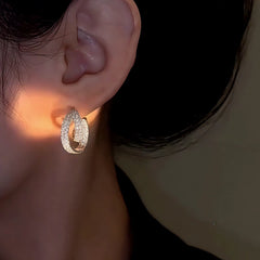 Close-up detail of the sparkling zircons and plating on the Geometric Hoop Earrings