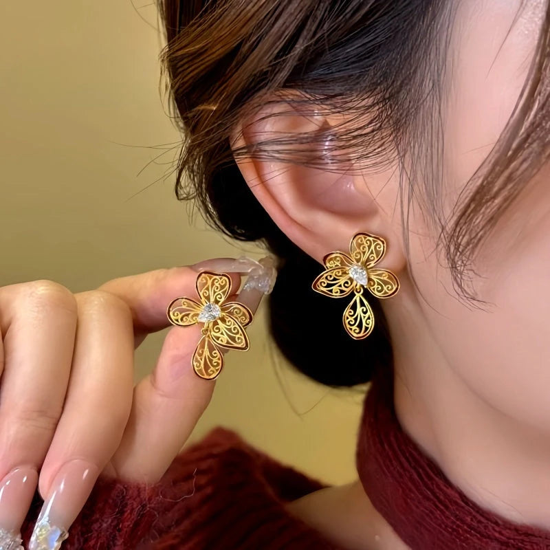 Close-up detail of the sparkling zircons and plating on the Filigree Flower Earrings